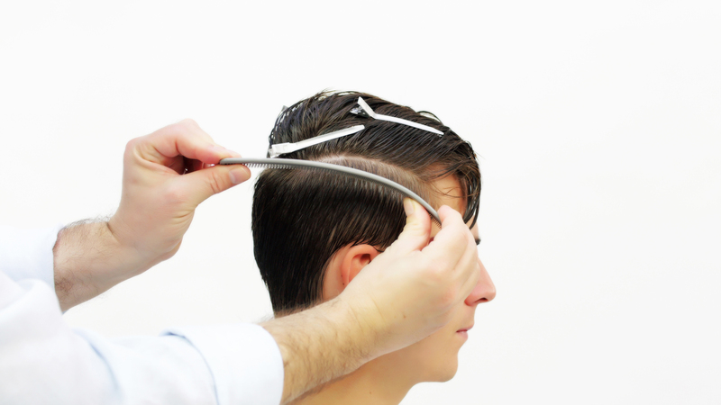 Photo of a man getting his hair cut