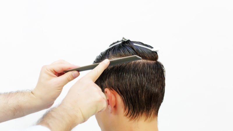 Photo of a man getting his hair cut
