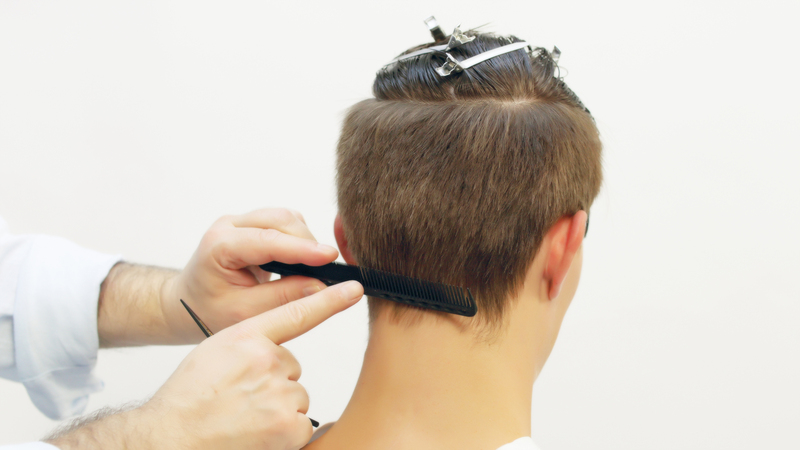 Photo of a man getting his hair cut