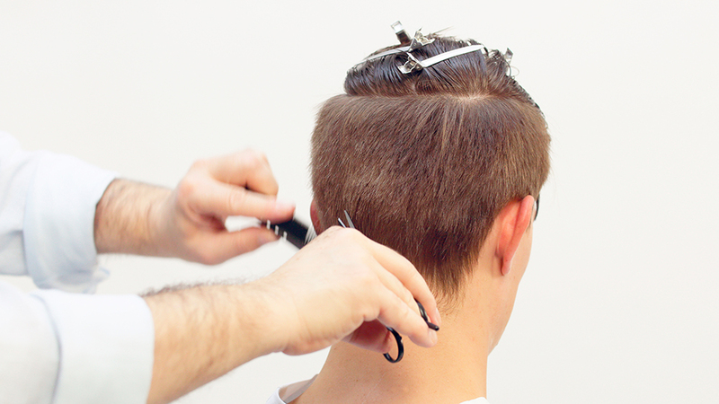 Photo of a man getting his hair cut