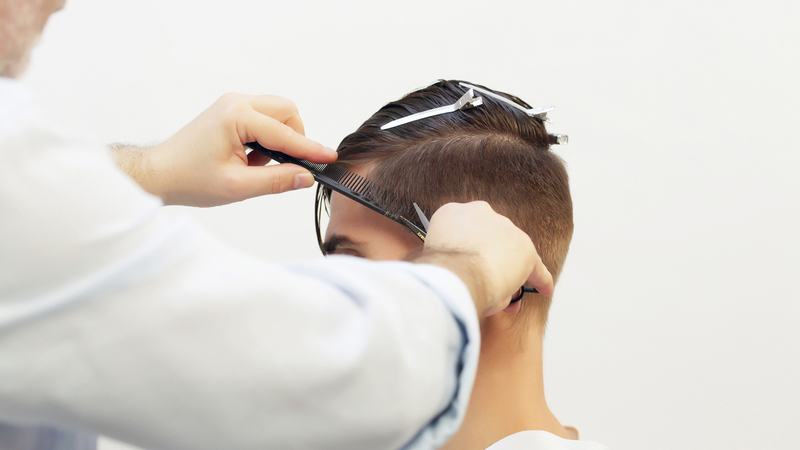 Photo of a man getting his hair cut