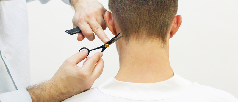 Photo of a man getting his hair cut