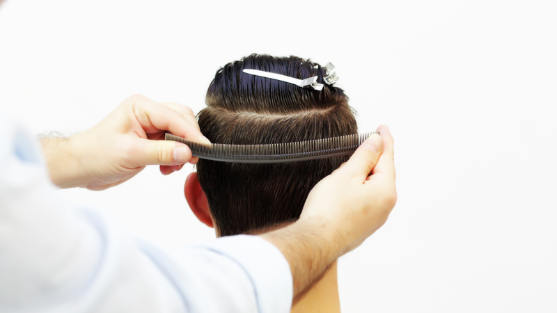 Photo of a man getting his hair cut