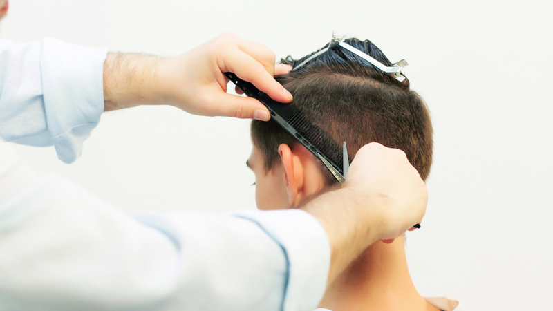 Photo of a man getting his hair cut