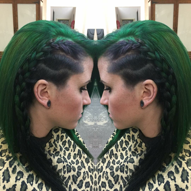 Shaved side with design green and black hair