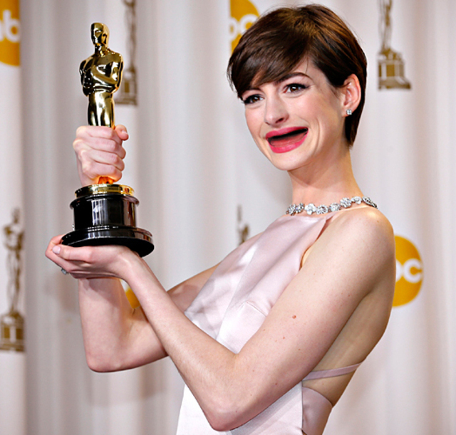Anne Hathaway holds her Oscar for winning Best Supporting Actress for her role in ""Les Miserables"" in Hollywood