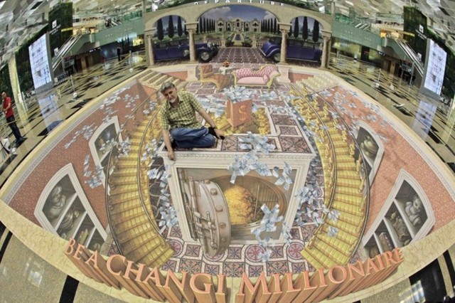 U.S. artist Wenner poses with his 3D art installation at Changi International Airport in Singapore