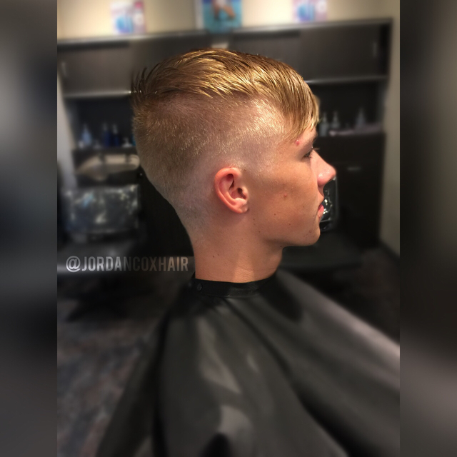 Skin fade done with shears and a textured, disconnected top. 