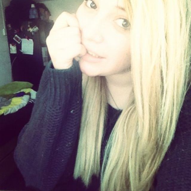 As a blonde.