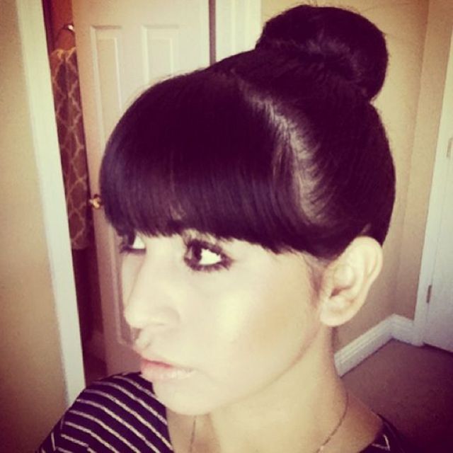 High bun and bangs