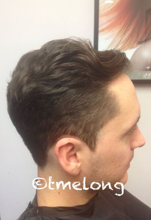 Scissor cut subtle fade with slight disconnection. 