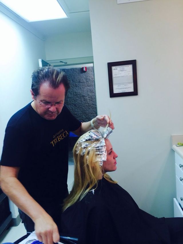 Tim Telles doing some hair at the Village of Hope homeless shelter in Tustin.Ca.