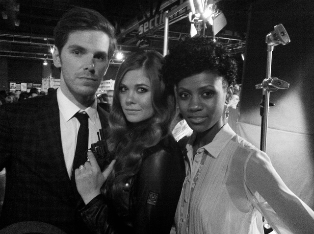 Models striking a pose backstage 