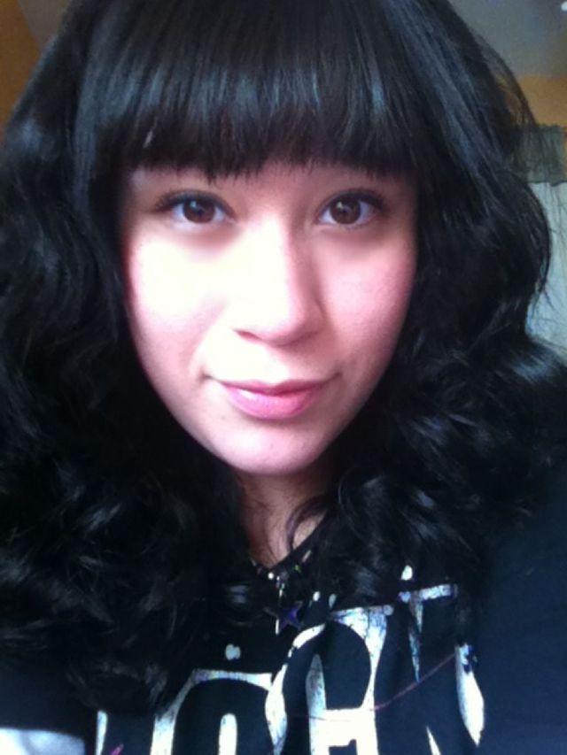 black curly with bangs.