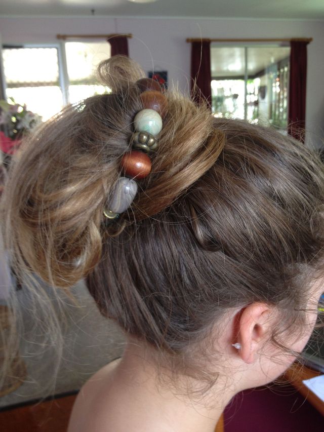 bun wrapped in necklace