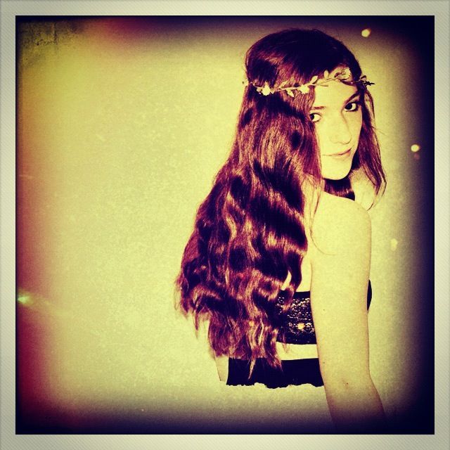 curly hair with flower band