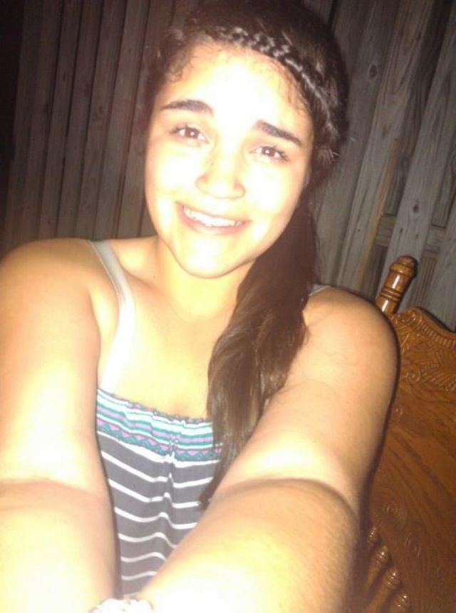 down bread bangs and hair in side pony tail 