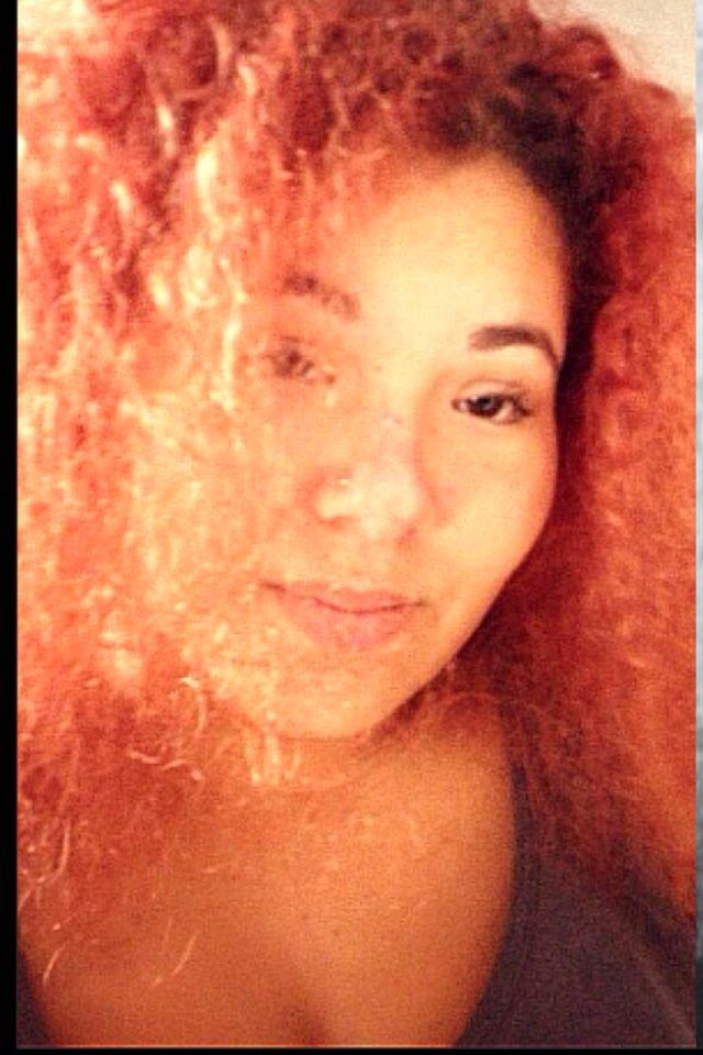 orange red curly big hair 