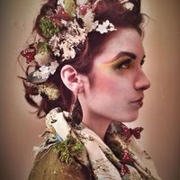 Thumb katniss%20evergreen%20hunger%20games%20inspired%20look%20faux%20hawk%20updo%20with%20nature%20accents%20and%20ultimate%20face%20cosmetics%20make up 1384390227